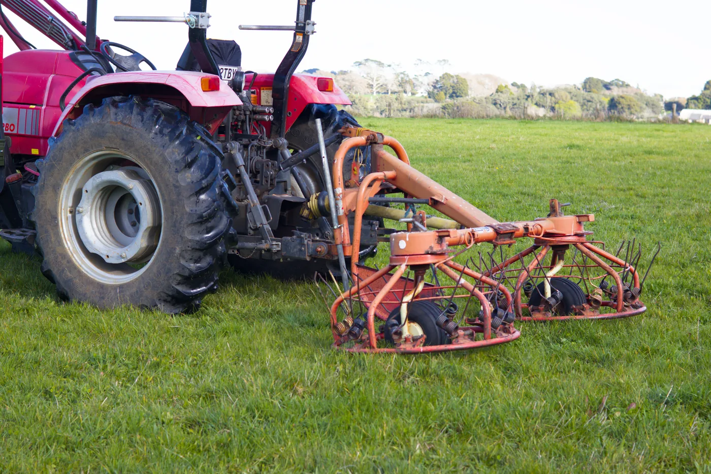 Raking attachment on tractor